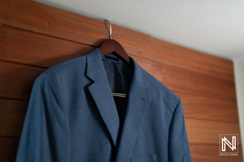 Hanging formal suit in preparation for a wedding at Avila Beach Hotel in Curacao, showcasing elegant attire for a special occasion