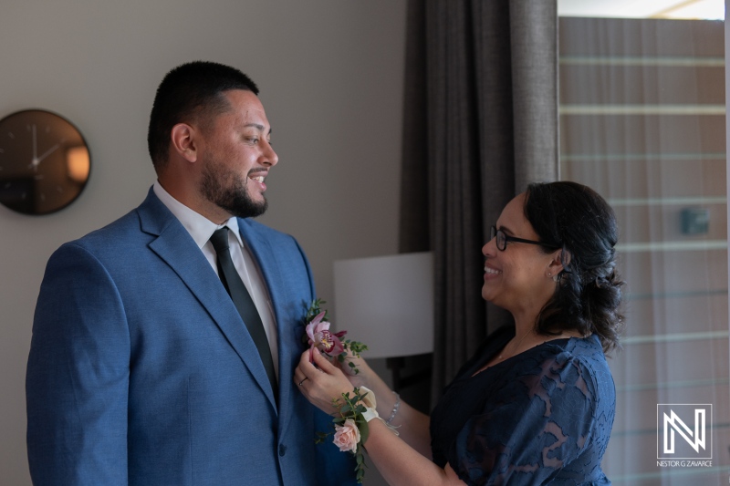 Groom prepares for wedding ceremony at Avila Beach Hotel in Curacao with emotional moments shared