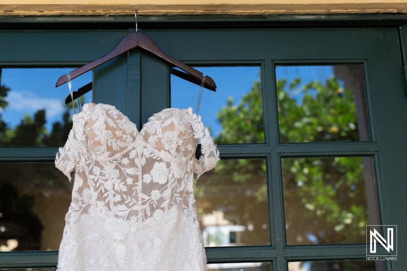 Elegant wedding dress displayed at Avila Beach Hotel in Curacao, capturing the essence of romance and celebration