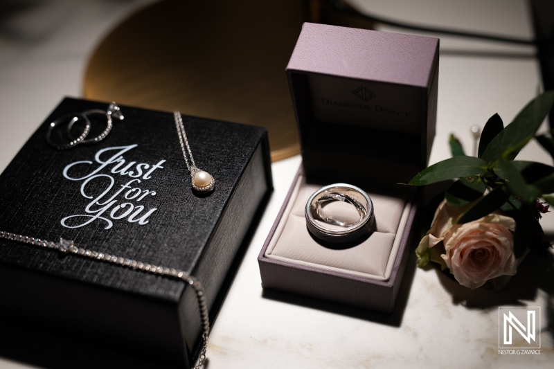 Engagement and wedding rings displayed alongside jewelry in beautiful setting at Avila Beach Hotel in Curacao