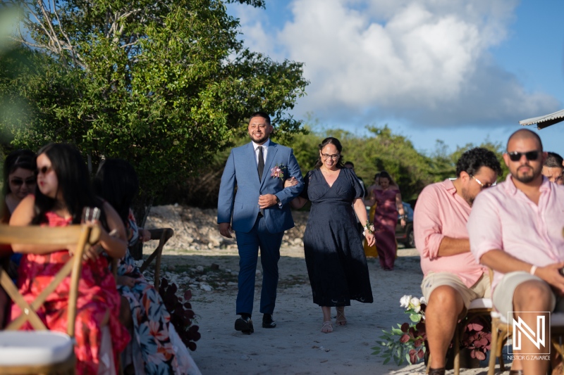 Wedding ceremony at Playa Hunku in Curacao featuring guests celebrating a special moment