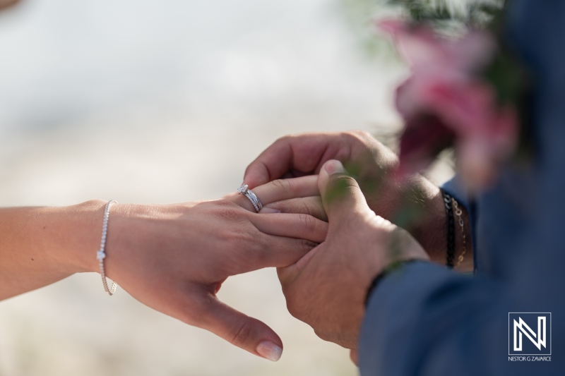 Joyful couple exchanging wedding vows at Playa Hunku in Curacao during a beautiful beach ceremony under the romantic sun