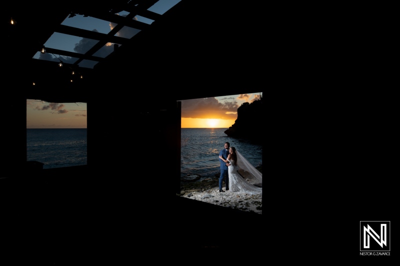 Couple embraces during sunset at Playa Hunku in Curacao, creating a romantic wedding moment by the ocean