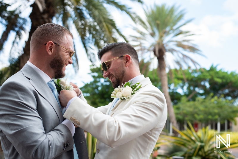 Groom helping groomsmen