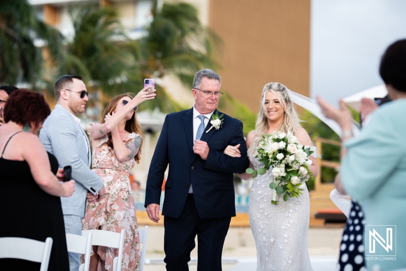 Bride walking down the aisle with father
