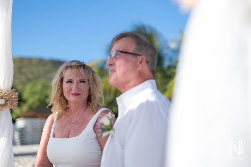 Couple enjoying a beautiful wedding ceremony at Playa Porto Mari in Curacao surrounded by picturesque scenery and heartfelt emotions