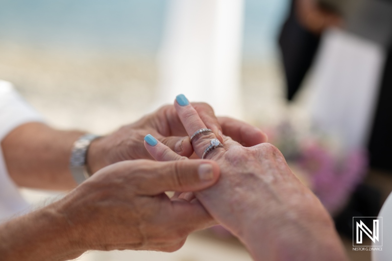 Ceremony of love at Playa Porto Mari in Curacao with exchanging of rings and heartfelt vows on a beautiful wedding day