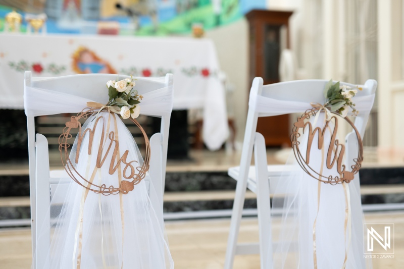 Decorative chairs with Mr and Mrs signs create a romantic atmosphere for a wedding celebration in Curacao