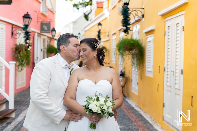 Couple celebrates their wedding in the colorful streets of Curacao with joy and love radiating in the vibrant atmosphere