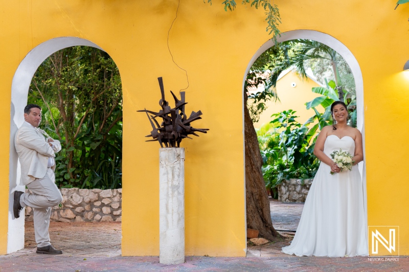 Romantic wedding moment in Curacao featuring a bride and groom amidst vibrant tropical ambiance