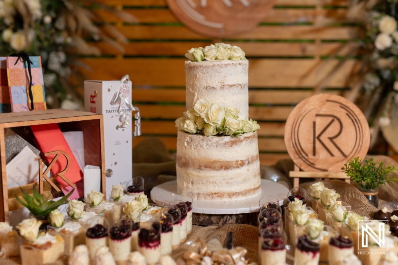 Elegant wedding dessert table featuring a layered cake and assorted treats in Curacao