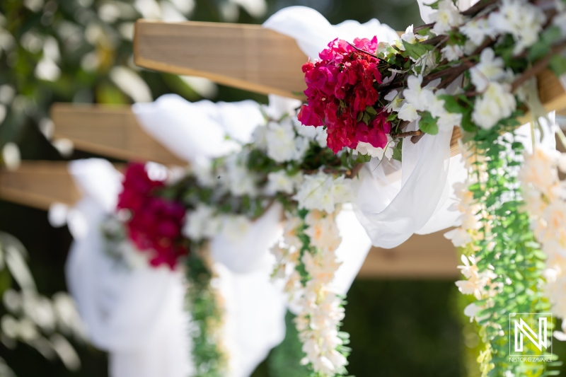 Vibrant floral decorations at a picturesque wedding venue in Curacao with beautiful blooms enhancing the romantic atmosphere