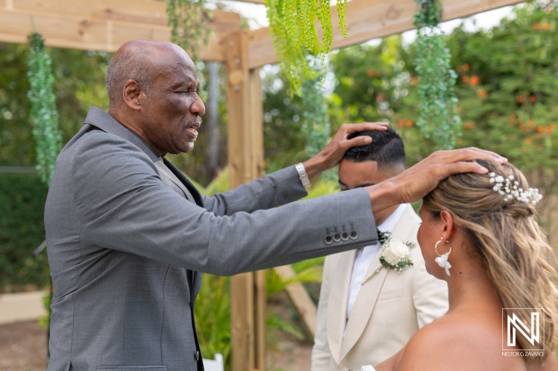 Celebration of love at a beautiful wedding ceremony in Curacao surrounded by lush greenery and heartfelt emotions