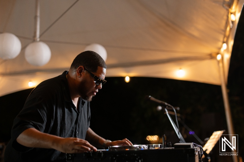 DJ performing live at a stunning wedding celebration in Curacao under twinkling lights