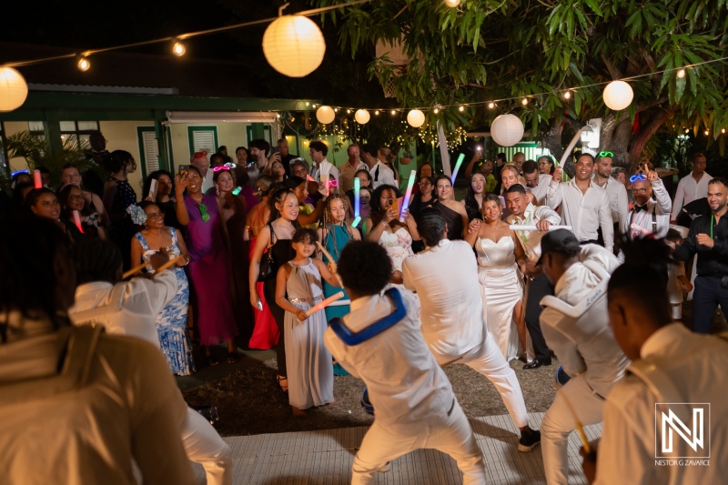 Celebration of love in Curacao with lively performances, guests enjoying the night at a wedding reception