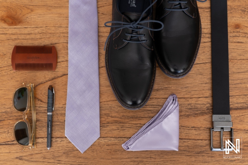 Wedding attire arrangement featuring stylish shoes, accessories, and elegant details at Avila Beach Hotel in Curacao