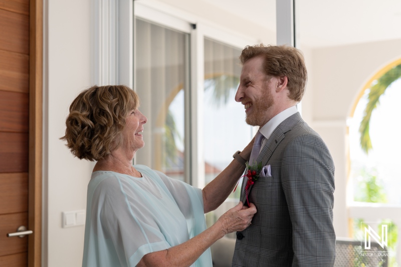 Groom receives a heartfelt moment with his mother before a wedding at Avila Beach Hotel in Curacao