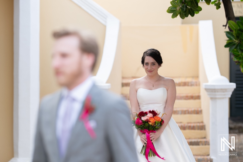 Couple celebrates love during a romantic wedding ceremony at Avila Beach Hotel in Curacao surrounded by tropical beauty and emotional moments