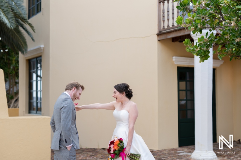 Celebrating love and joy during a wedding ceremony at Avila Beach Hotel in Curacao with vibrant colors and laughter