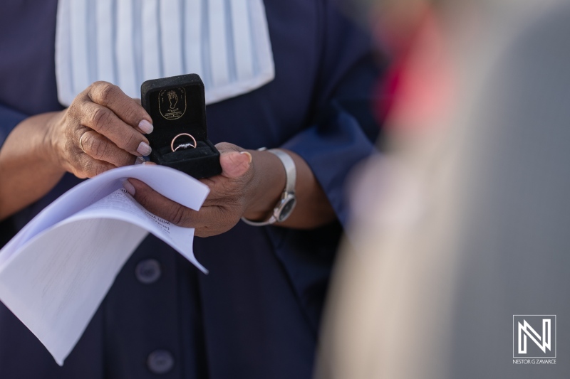 Wedding ceremony at Avila Beach Hotel in Curacao with a focus on the rings being exchanged
