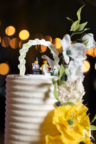 Unique wedding cake topper featuring Lego couple at Avila Beach Hotel in Curacao during a beautiful celebration