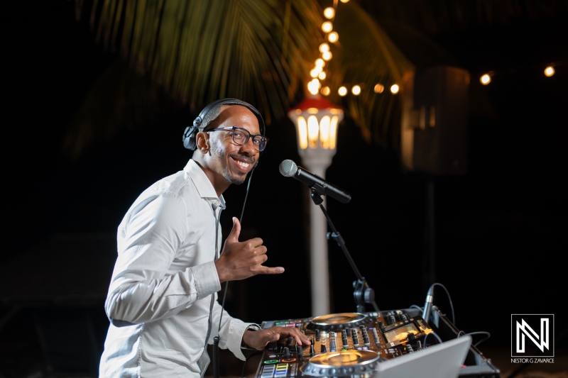DJ entertaining guests at a wedding reception at Avila Beach Hotel in Curacao during a beautiful evening celebration