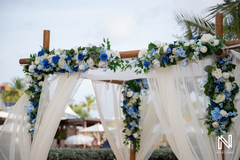 Wedding ceremony setup with floral decorations at Avila Beach Hotel in Curacao during sunny day