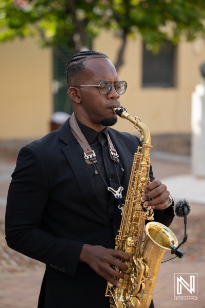 Musician plays saxophone during wedding ceremony at Avila Beach Hotel in Curacao