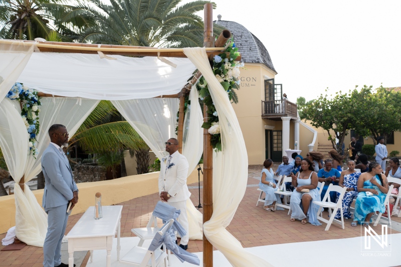 Couples exchange vows at Avila Beach Hotel during a wedding ceremony in Curacao on a sunny day by the beach