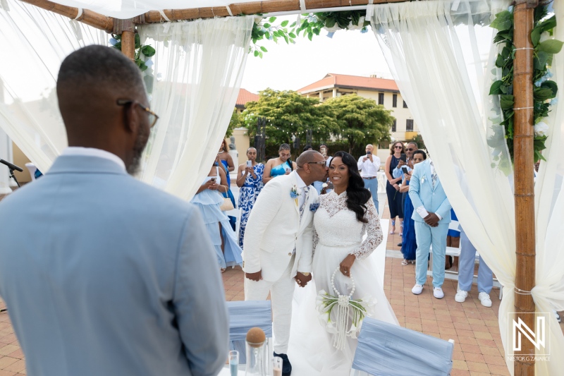 Couple exchanges vows during wedding ceremony at Avila Beach Hotel in Curacao