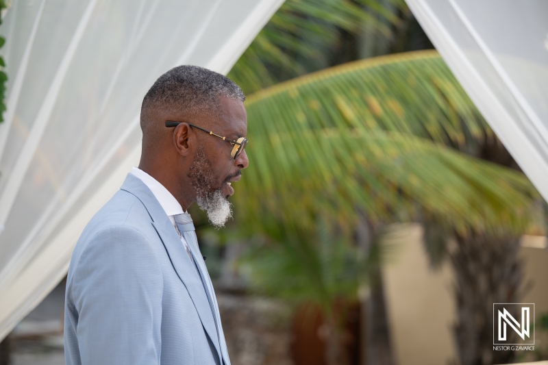 Wedding ceremony at Avila Beach Hotel in Curacao with a groom standing during the event