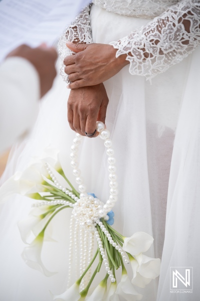 Couple exchanges vows at Avila Beach Hotel during wedding ceremony in Curacao