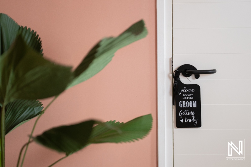 Groom's preparation at Mangrove Beach venue during wedding event in Curacao on a warm day