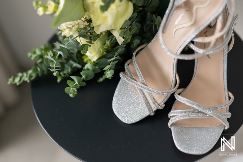 Elegant bridal shoes resting beside a beautiful bouquet at a wedding in Mangrove Beach Corendon, Curacao
