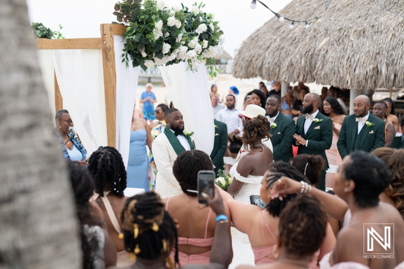 Ceremony at Mangrove Beach Corendon in Curacao surrounded by joyful guests celebrating a beautiful wedding day