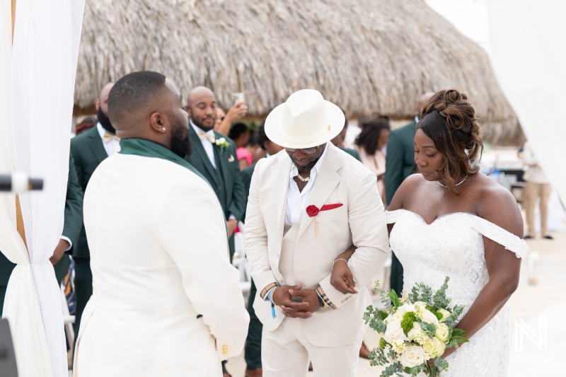 Wedding ceremony at Mangrove Beach Corendon in Curacao with an elegant couple exchanging vows surrounded by friends and family