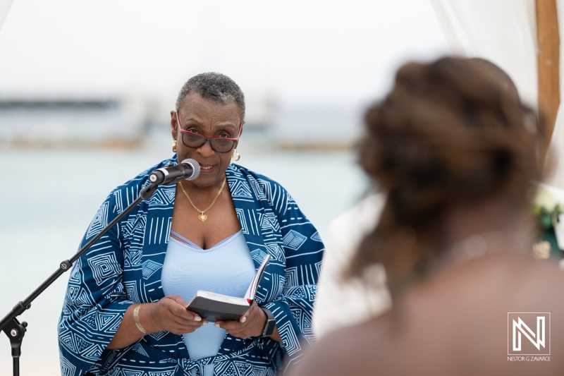 Wedding ceremony at Mangrove Beach in Curacao with a heartfelt officiant addressing the couple on a picturesque day