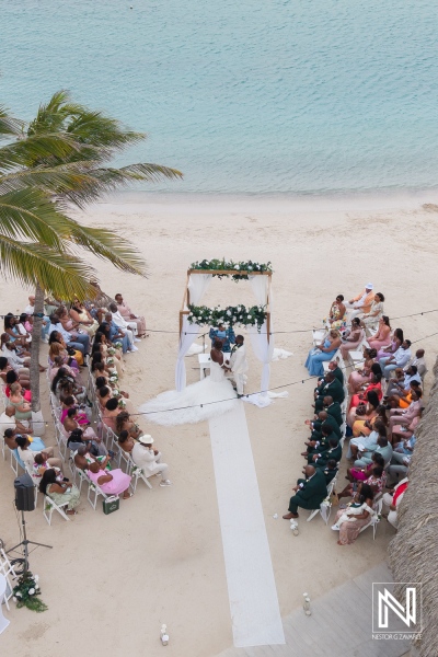 Celebration of love at Mangrove Beach Corendon in Curacao with a stunning ocean backdrop during a beautiful wedding ceremony