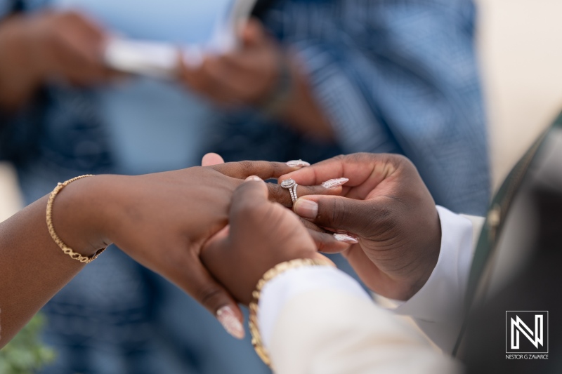 Couple exchanges wedding rings during intimate ceremony at Mangrove Beach Corendon in Curacao