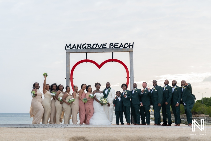 Wedding celebration at Mangrove Beach Corendon in Curacao with joyful guests gathered by the ocean