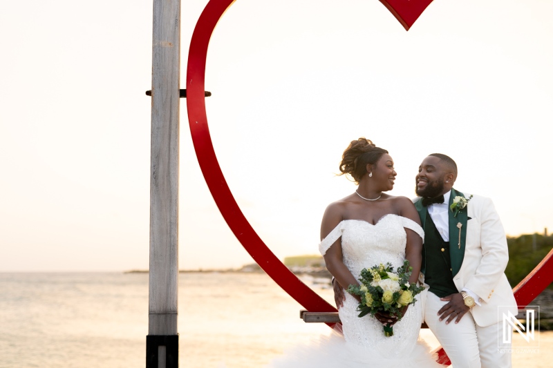 Couple celebrates their wedding at Mangrove Beach in Curacao surrounded by love and natural beauty during sunset