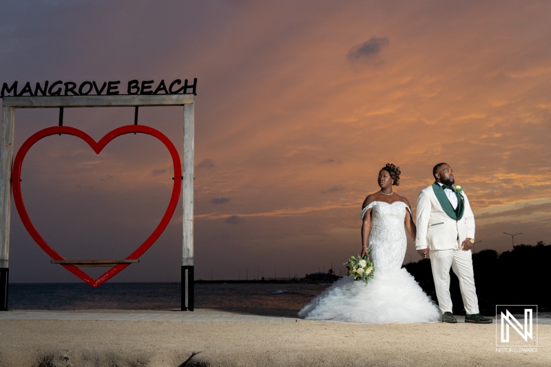 Memorable wedding ceremony at Mangrove Beach in Curacao with stunning sunset backdrop