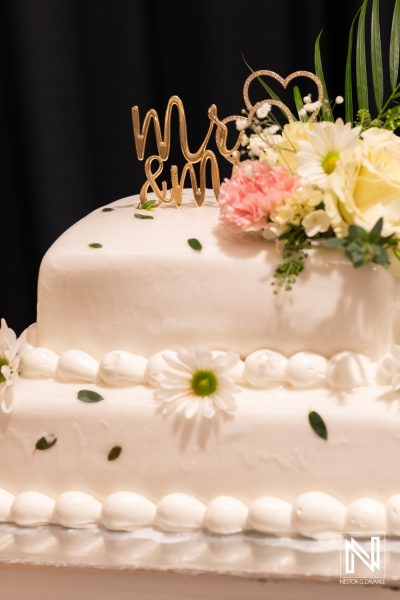 Celebration of love with an elegant wedding cake at Mangrove Beach Corendon in Curacao during a beautiful wedding ceremony