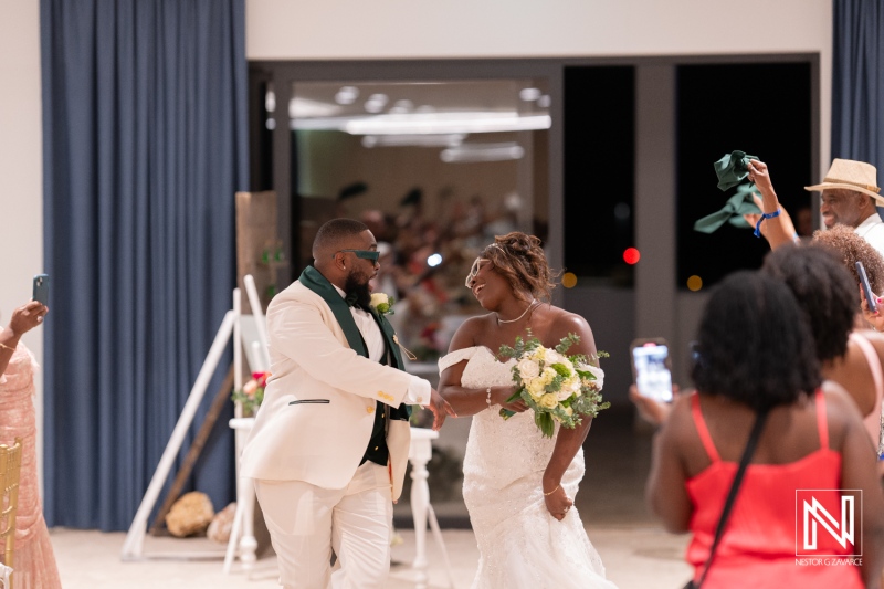 Couple celebrates wedding reception at Mangrove Beach Corendon in Curacao with joyful guests in attendance