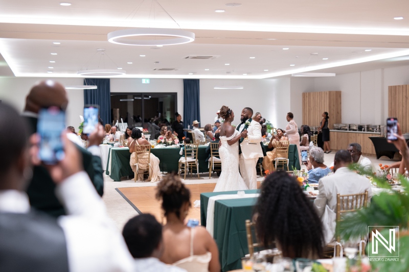 Celebration and joy during a wedding reception at Mangrove Beach Corendon in Curacao with family and friends gathered together