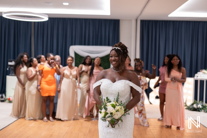 Celebration of love at Mangrove Beach Corendon in Curacao with a beautiful bride and joyful bridesmaids
