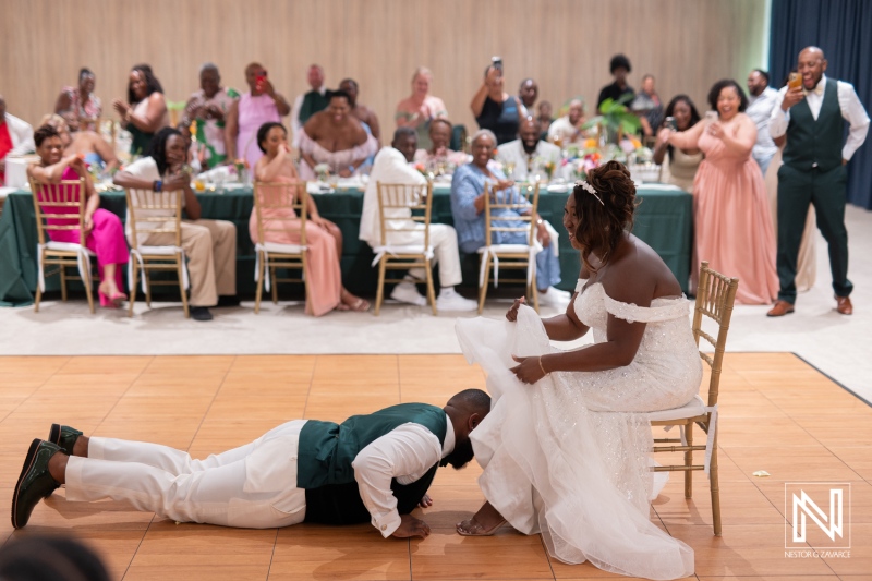 Couple celebrates love in a joyful wedding ceremony at Mangrove Beach Corendon in Curacao, surrounded by family and friends
