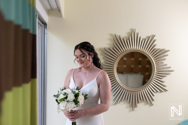Bride preparing with bouquet at Sunscape Curacao Resort on a beautiful wedding day