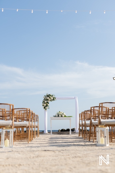 Beautiful wedding setup on the beach at Sunscape Curacao Resort with decor and seating arranged for an outdoor ceremony