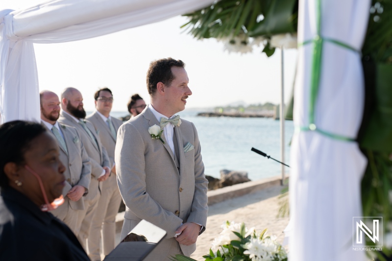 Couples exchange vows during a picturesque wedding ceremony at Sunscape Curacao Resort with a serene beach backdrop